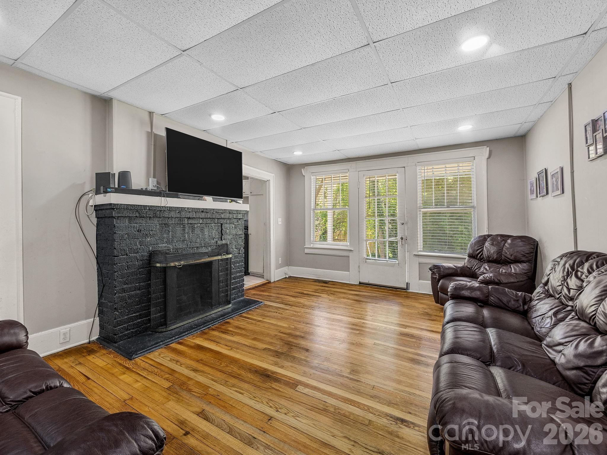 110 Grady Avenue Tryon, NC 28782 - Photo 26 of 41 a living room with furniture fireplace and flat screen tv
