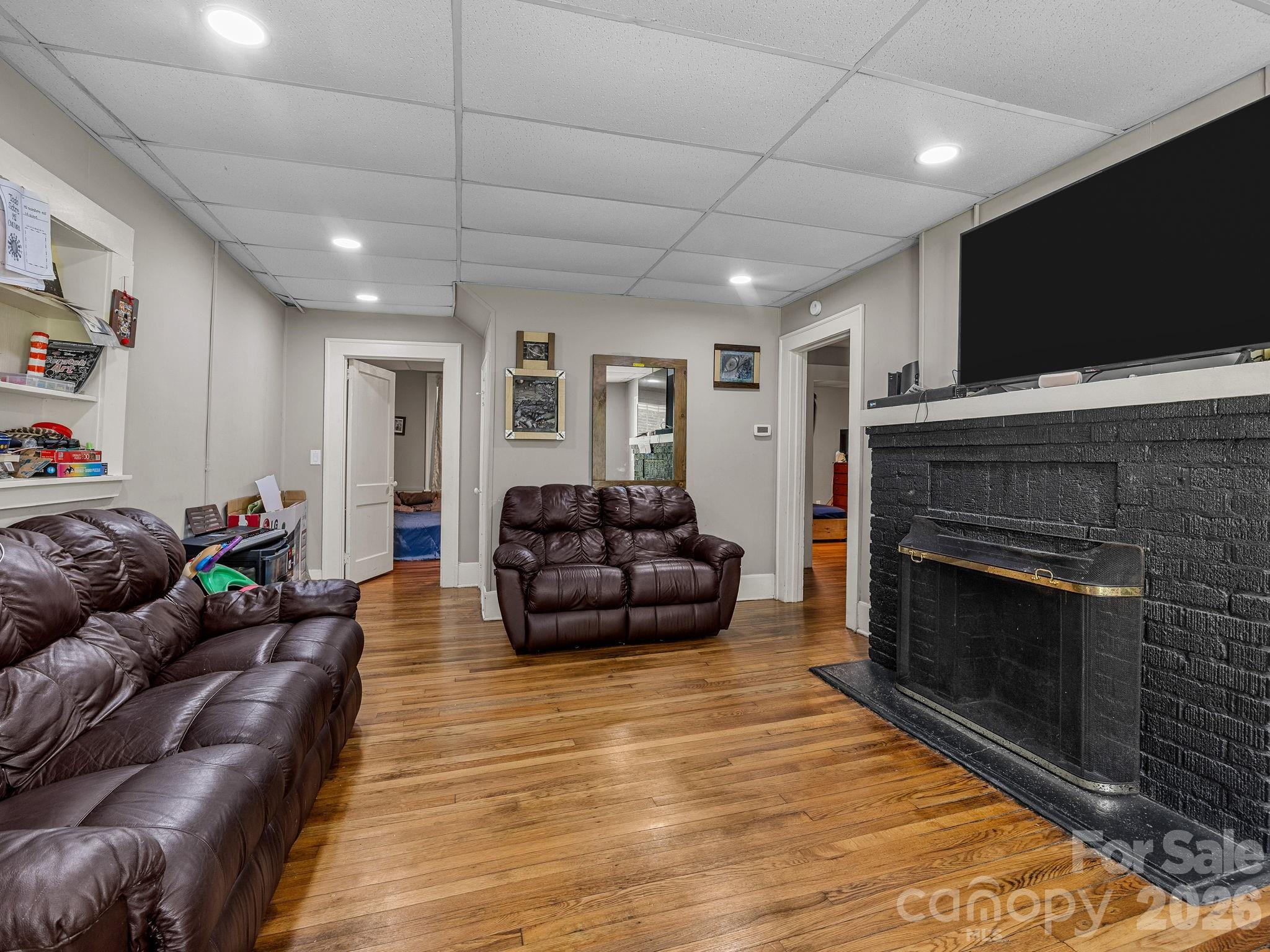 110 Grady Avenue Tryon, NC 28782 - Photo 27 of 41 a living room with furniture and a flat screen tv