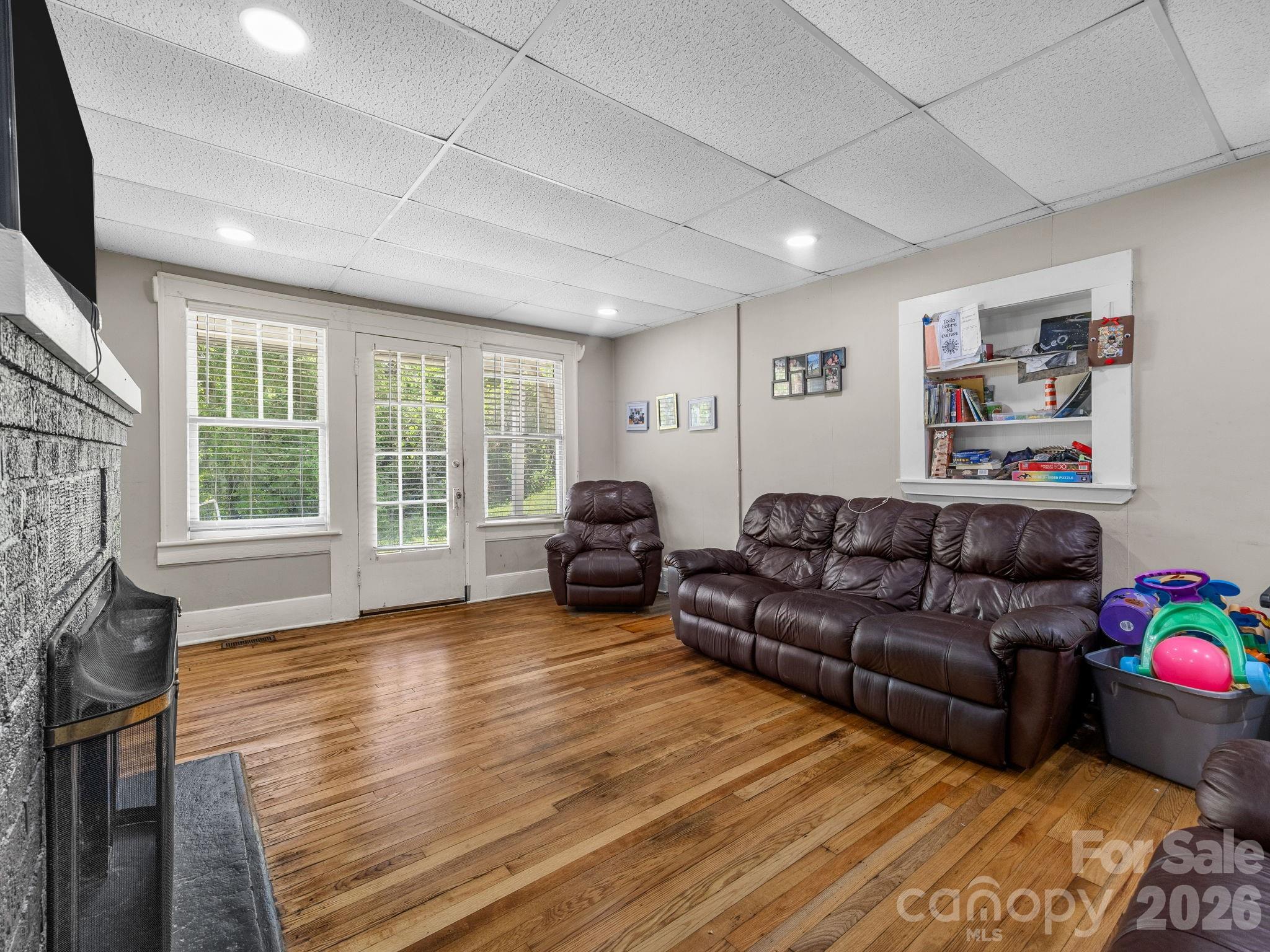 110 Grady Avenue Tryon, NC 28782 - Photo 29 of 41 a living room with furniture and a flat screen tv
