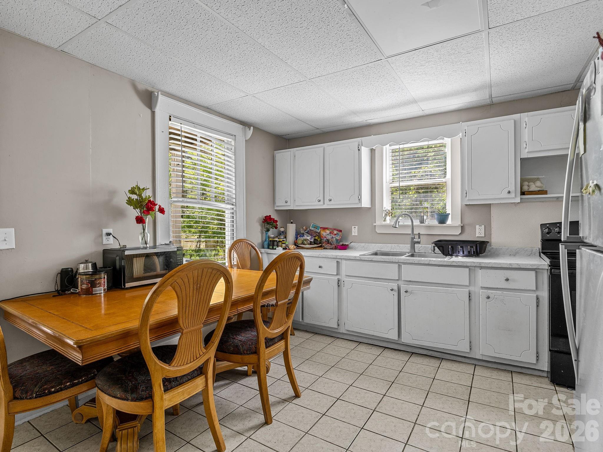 110 Grady Avenue Tryon, NC 28782 - Photo 30 of 41 a dining room with furniture and window