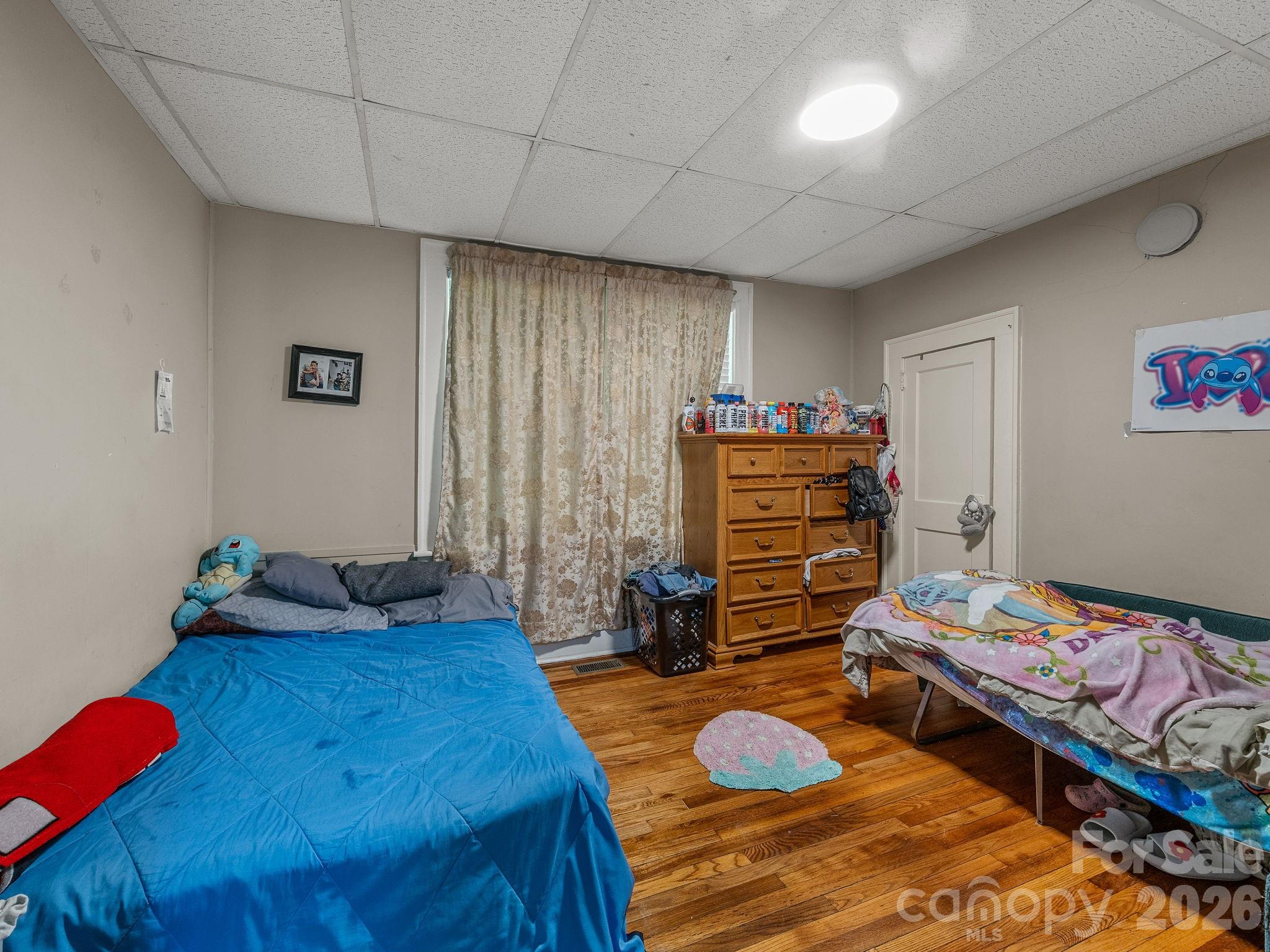 110 Grady Avenue Tryon, NC 28782 - Photo 35 of 41 a bedroom with a bed and furniture