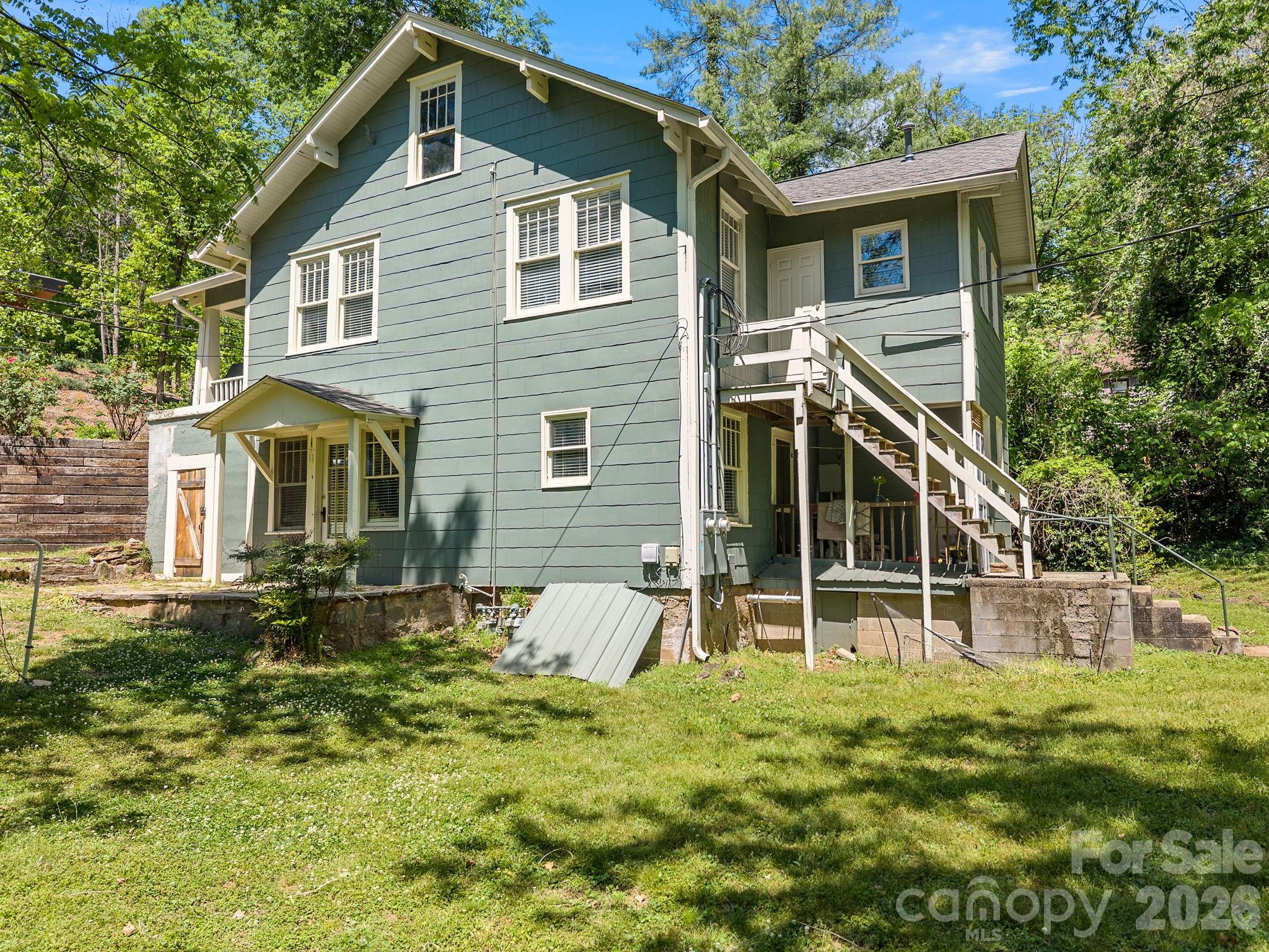 110 Grady Avenue Tryon, NC 28782 - Photo 38 of 41 a front view of a house with a yard