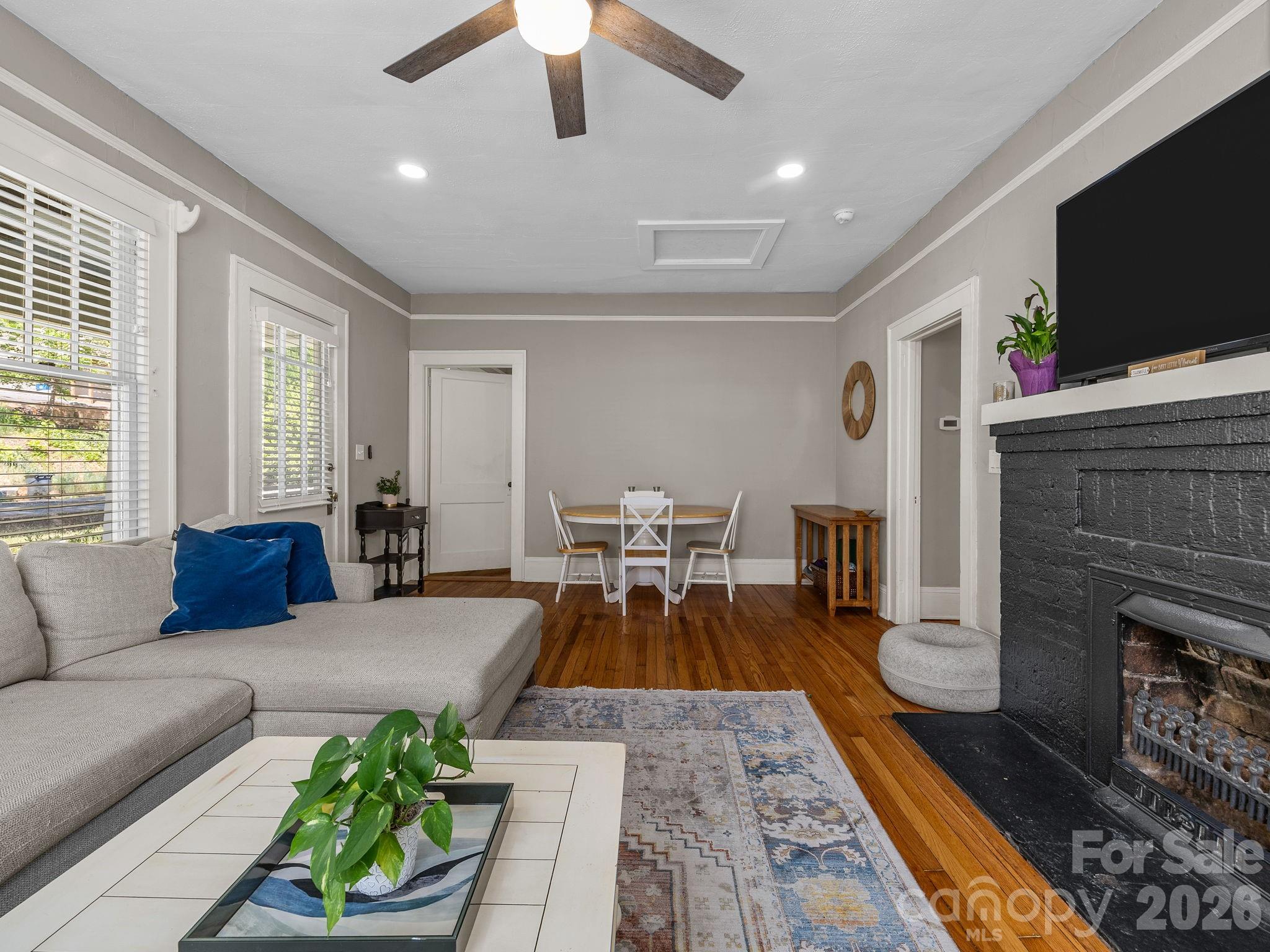 110 Grady Avenue Tryon, NC 28782 - Photo 10 of 41 a living room with furniture and a flat screen tv