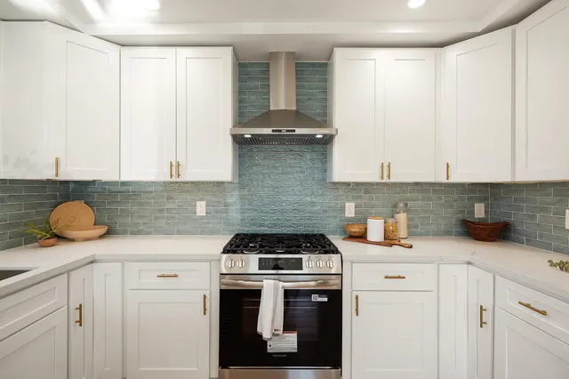 a kitchen with a sink and cabinets