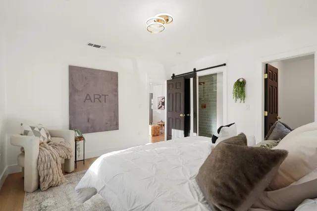 a bedroom with a bed and a table