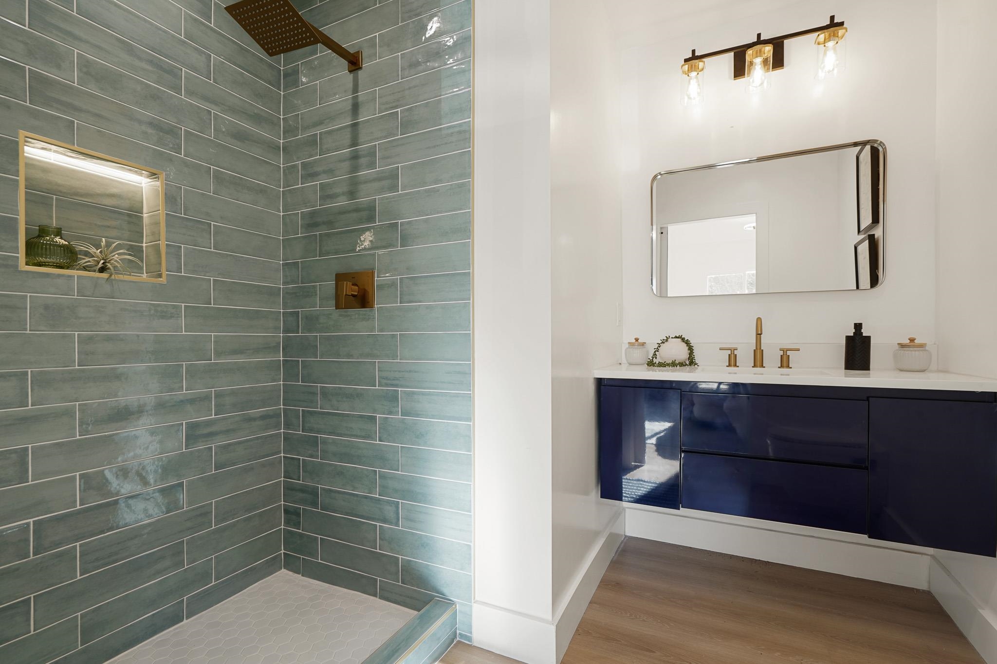 2151 Santa Rita Street Oakland, CA 94601 - Photo 19 of 46 Full bath featuring vanity, tiled shower, and light wood-style flooring