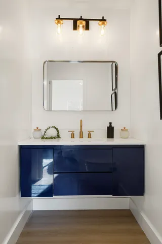 a view of hallway with a mirror and lamp