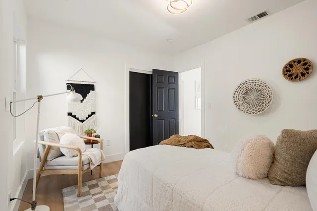 a bedroom with a bed and a table