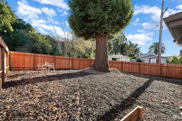 a backyard of a house with lots of green space