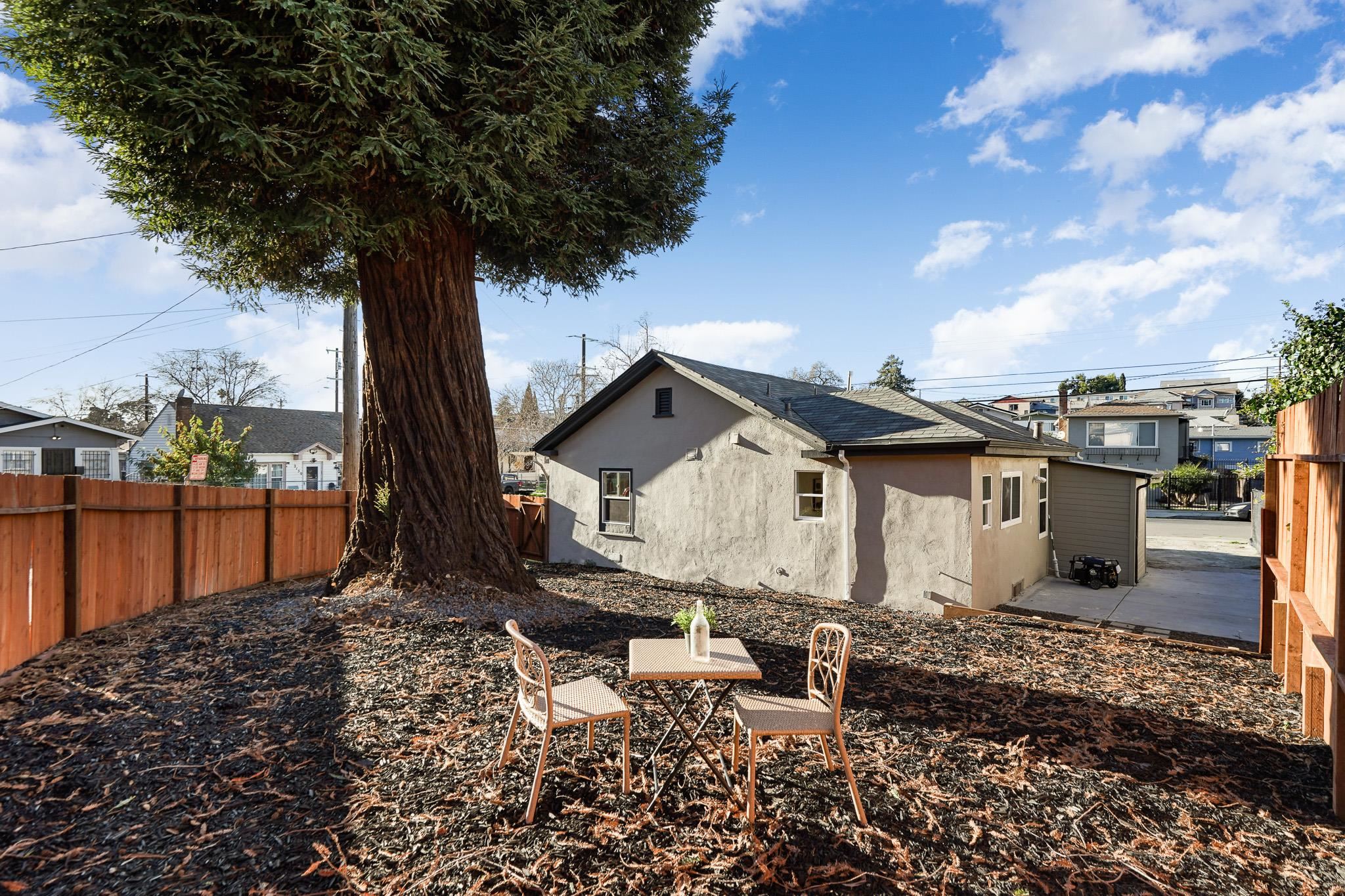 2151 Santa Rita Street Oakland, CA 94601 - Photo 36 of 46 Rear view of property featuring stucco siding and a residential view