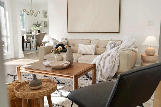 a living room with furniture and a table