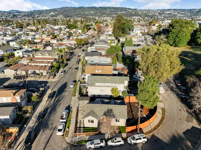 an aerial view of a house with a swimming pool