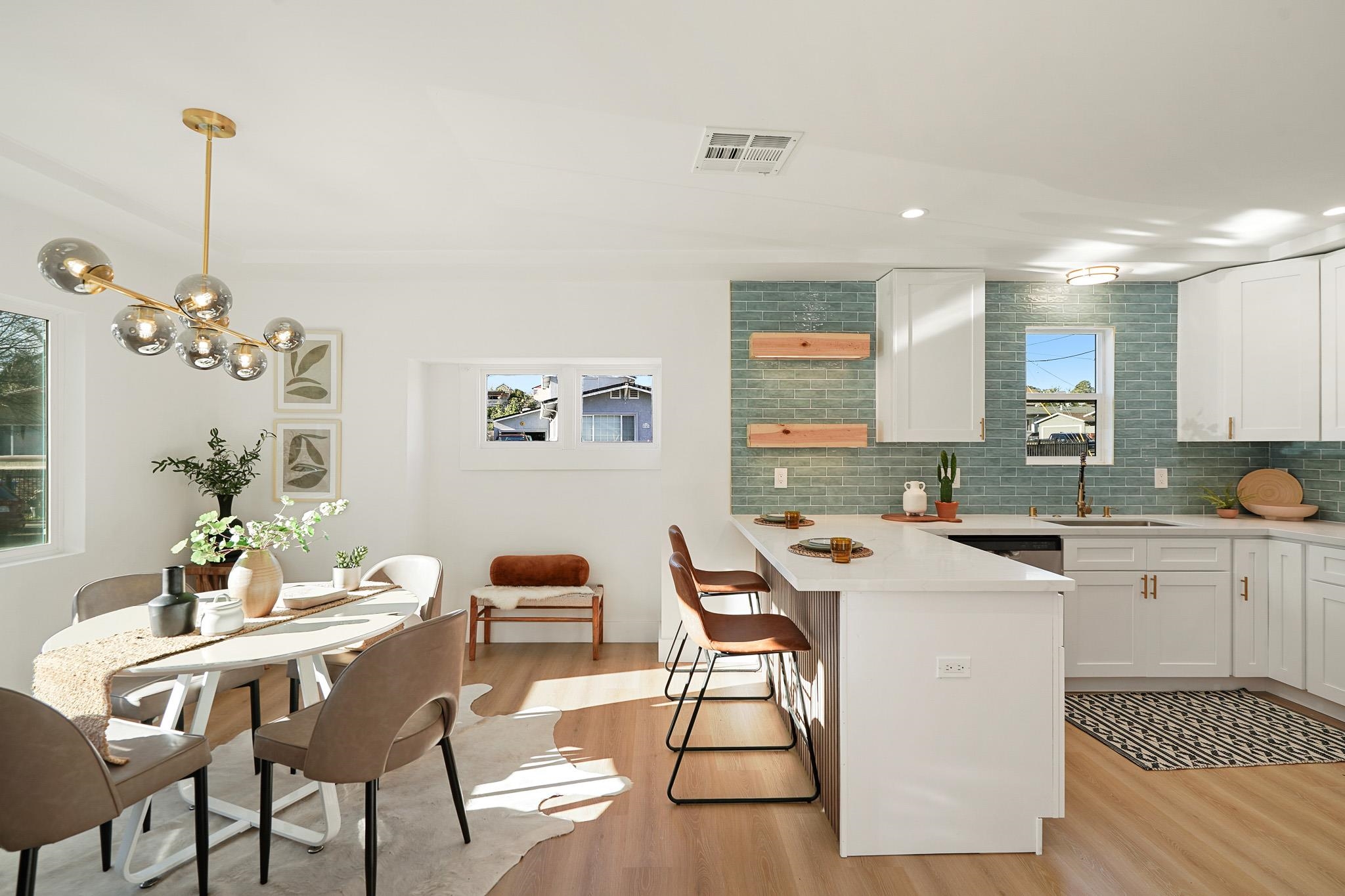 2151 Santa Rita Street Oakland, CA 94601 - Photo 6 of 46 Kitchen featuring tasteful backsplash, white cabinets, a peninsula, healthy amount of natural light, and recessed lighting