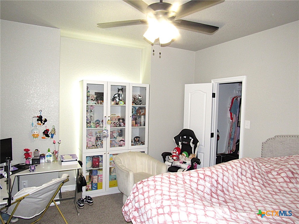 7606 Palladium Loop Killeen, TX 76542 - Photo 14 of 28 a bedroom with a bed and a large window
