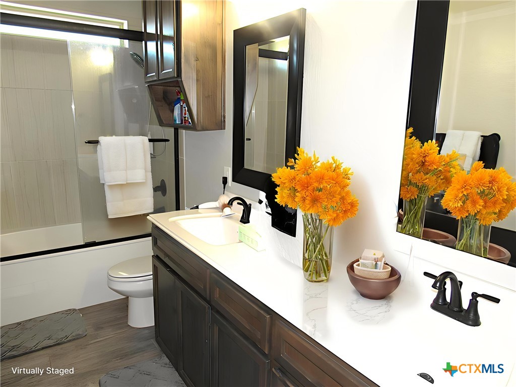 7606 Palladium Loop Killeen, TX 76542 - Photo 15 of 28 a bathroom with a sink and a mirror