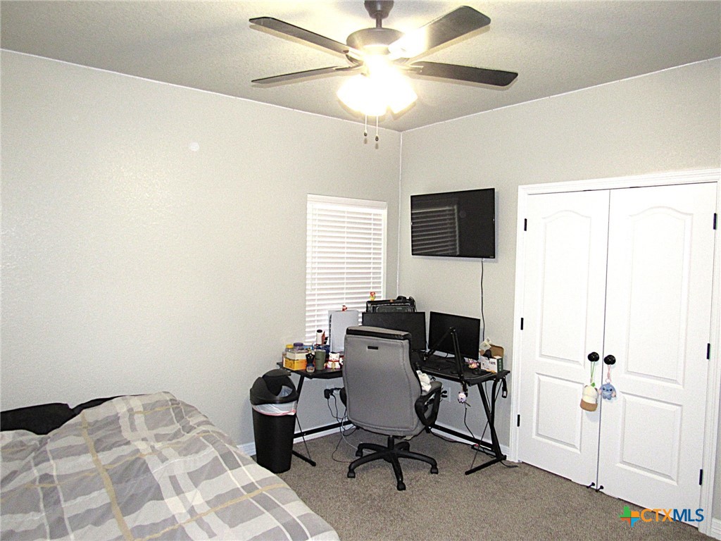 7606 Palladium Loop Killeen, TX 76542 - Photo 16 of 28 a view of a workspace with furniture and a window