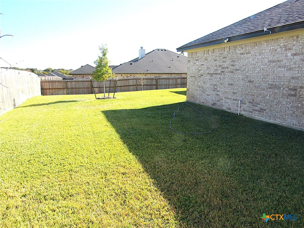 7606 Palladium Loop Killeen, TX 76542 - Photo 23 of 28 a view of a swimming pool with an outdoor space and seating area
