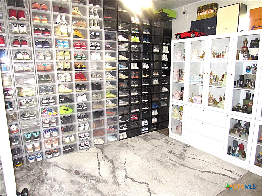 7606 Palladium Loop Killeen, TX 76542 - Photo 24 of 28 a view of store room with racks