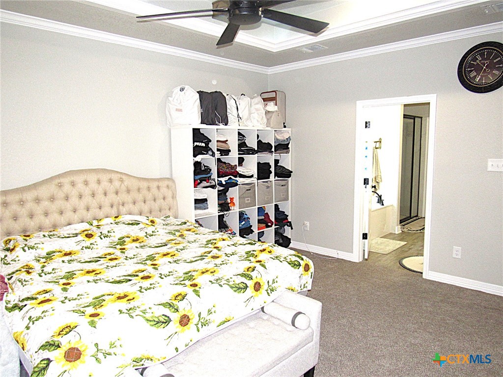 7606 Palladium Loop Killeen, TX 76542 - Photo 26 of 28 a bedroom with a bed and a dresser