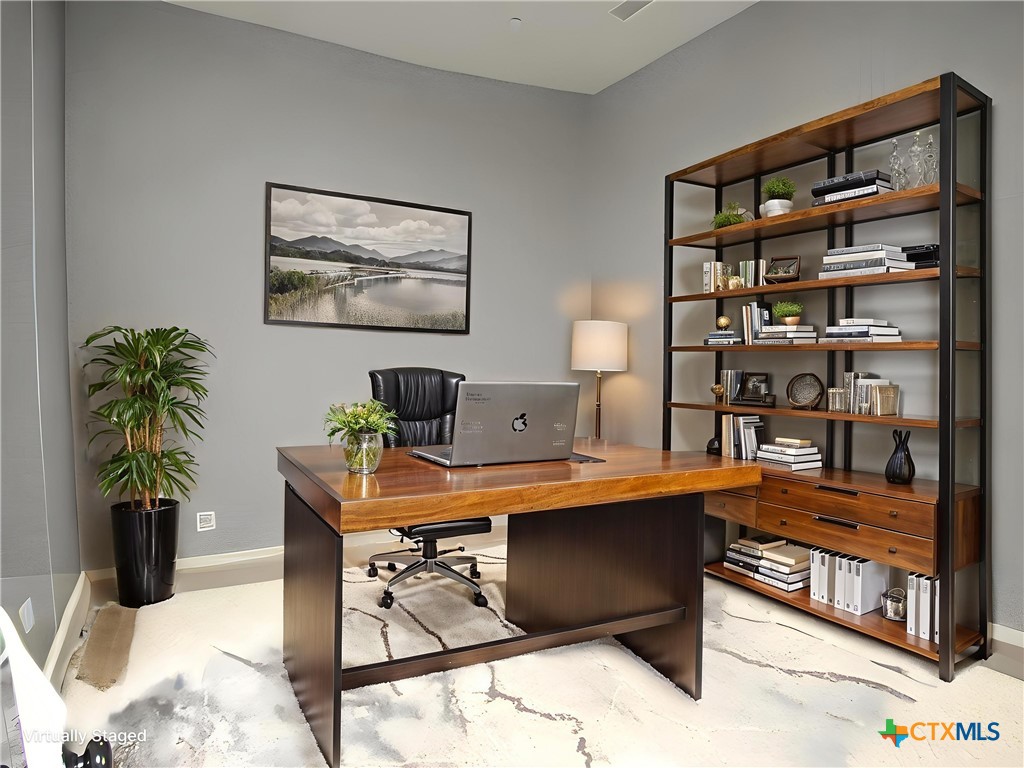 7606 Palladium Loop Killeen, TX 76542 - Photo 8 of 28 a room with furniture and book shelf