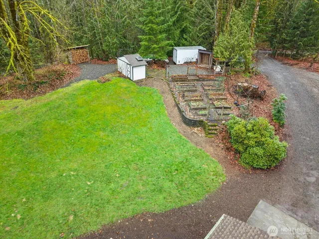 a view of a backyard with sitting area