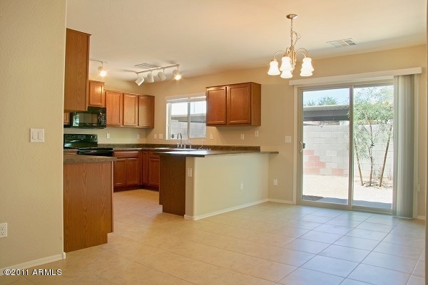 10225 West Camelback Road, Unit 41 Phoenix, AZ 85037 - Photo 6 of 23 Open Dining Area
