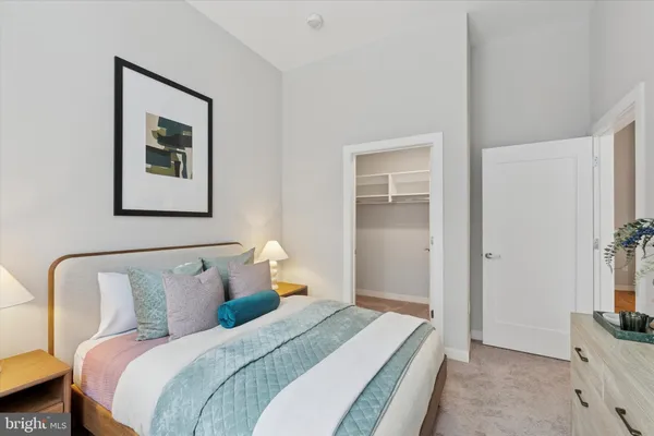 a bedroom with bed and a window