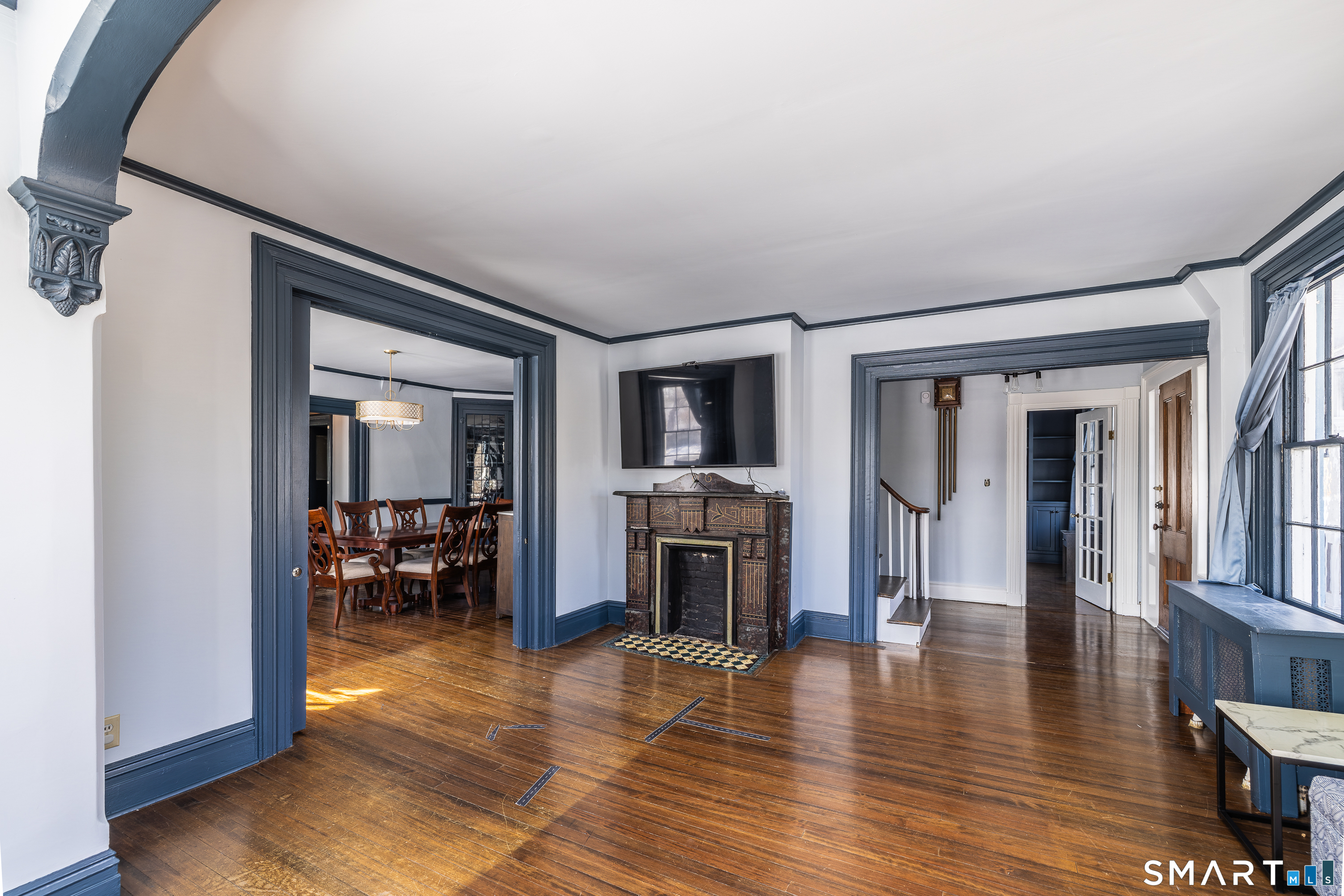 5385 Main Street Trumbull, CT 06611 - Photo 13 of 39 a view of a livingroom with furniture hardwood floor and a ceiling fan