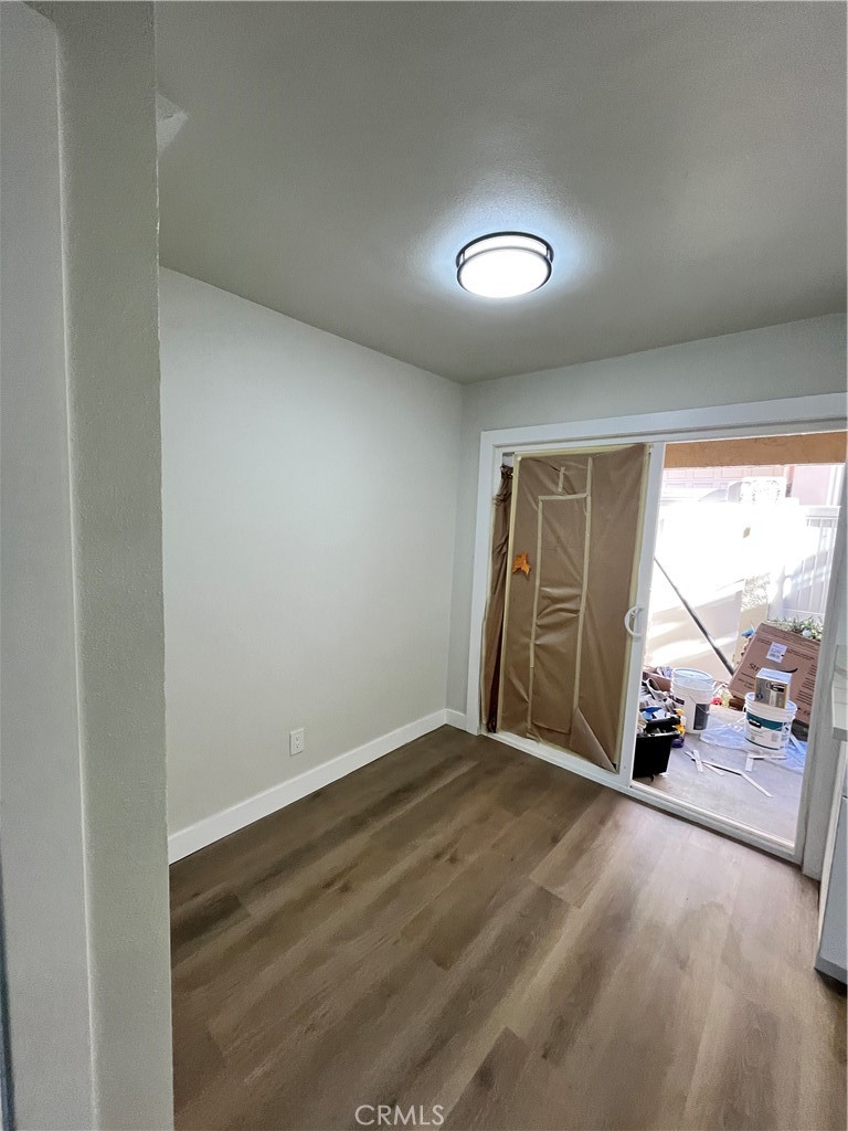 2007 Huntington Lane, Unit 2 Redondo Beach, CA 90278 - Photo 14 of 22 an empty room with a fireplace and large window