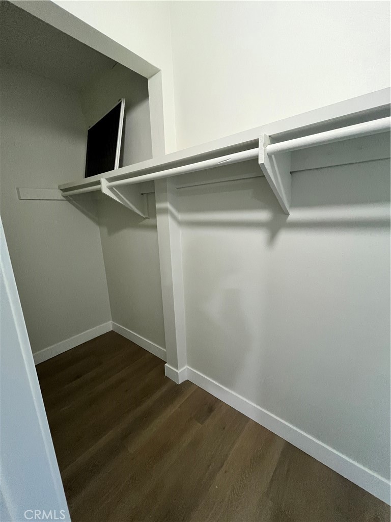 2007 Huntington Lane, Unit 2 Redondo Beach, CA 90278 - Photo 19 of 22 a view of an empty room with wooden floor and a window