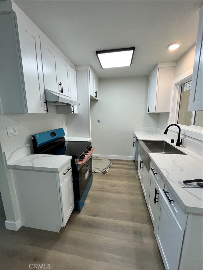 2007 Huntington Lane, Unit 2 Redondo Beach, CA 90278 - Photo 5 of 22 a kitchen with stainless steel appliances a sink stove and refrigerator