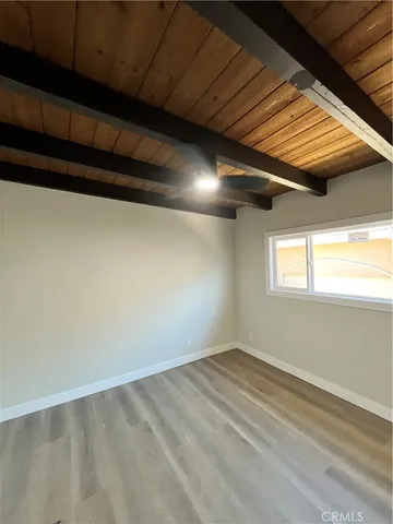 a view of hallway with wooden floor