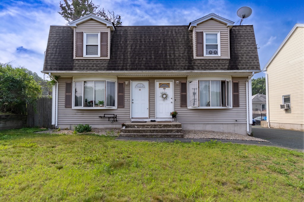 209-211 Verge Street Springfield, MA 01129 - Photo 1 of 14 a front view of a house with a yard