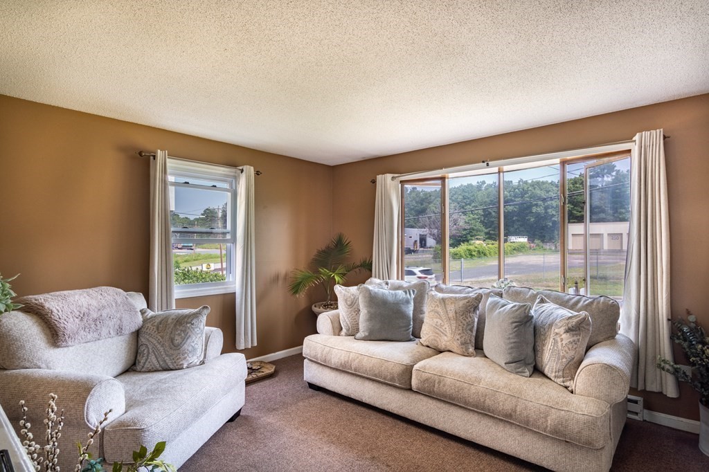 209-211 Verge Street Springfield, MA 01129 - Photo 4 of 14 a living room with furniture and a large window