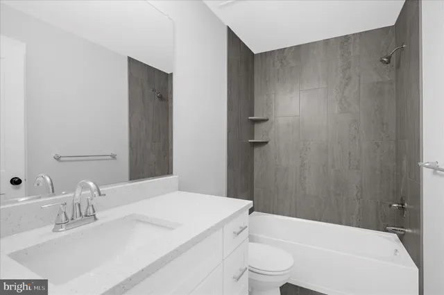 an empty room with window and ceiling fan