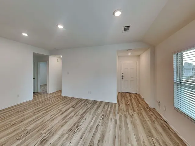 a kitchen with a stove a sink and a refrigerator