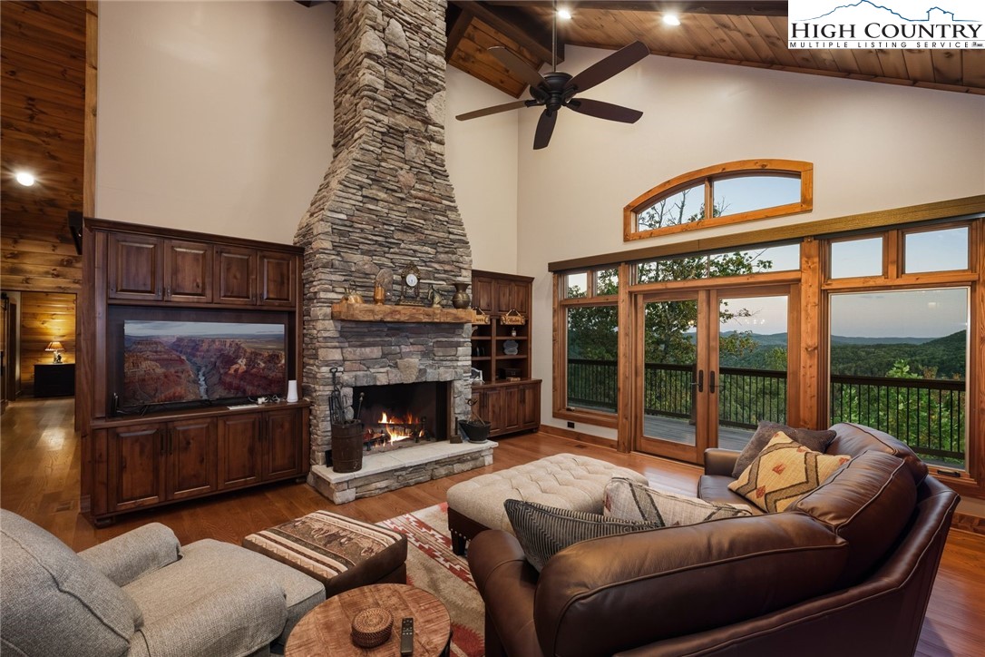 550 Big Sky Road Ferguson, NC 28624 - Photo 10 of 35 a living room with furniture and a fireplace