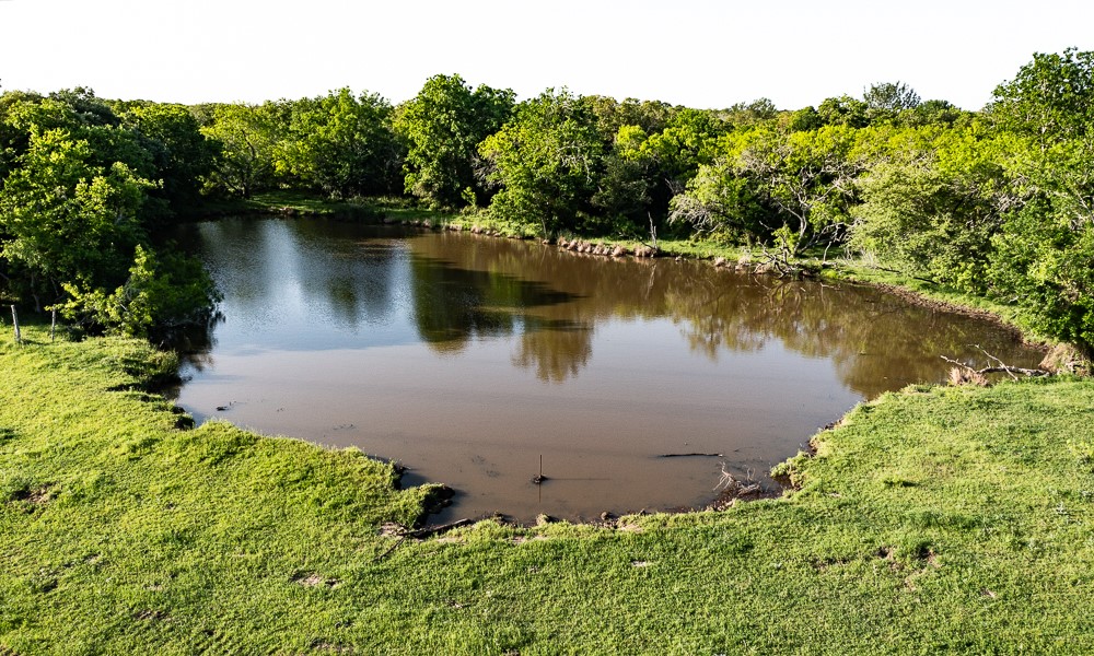 Tbd Anchor Ranch Loop Flatonia, TX 78941 - Photo 4 of 15 an aerial view of a house with a yard and lake view
