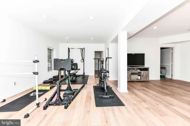 a view of a living room with furniture and a flat screen tv