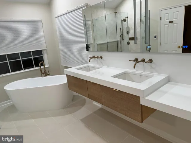 a bathroom with a bathtub and a sink