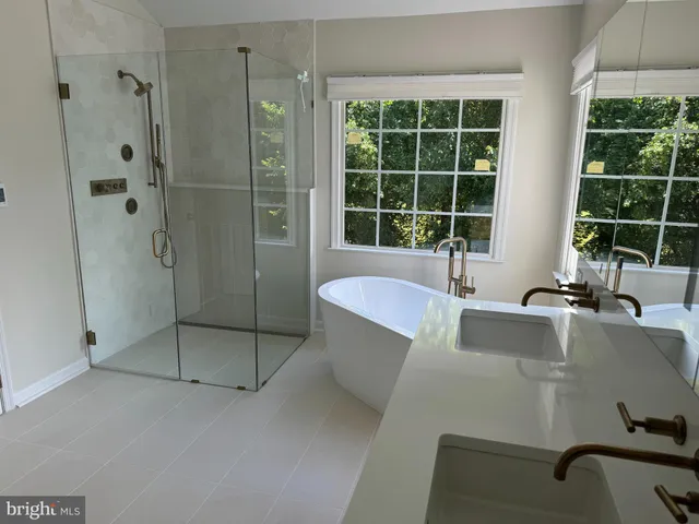 a bath tub sitting next to a window