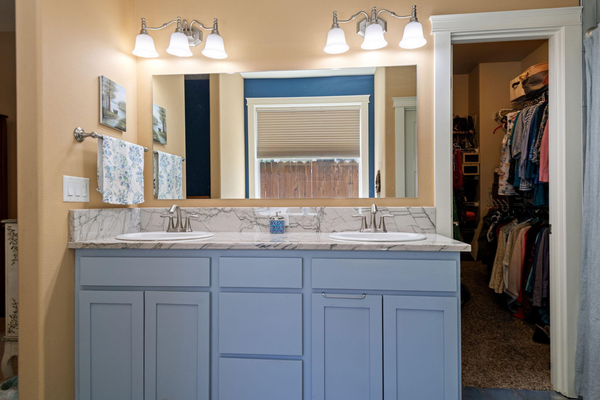 62944 Fresca Street Bend, OR 97703 - Photo 18 of 32 a bathroom with a granite countertop sink and a mirror