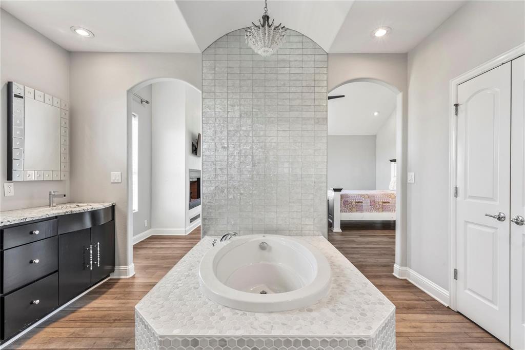 9583 Neal Road Forney, TX 75126 - Photo 12 of 34 a spacious bathroom with a sink and a mirror