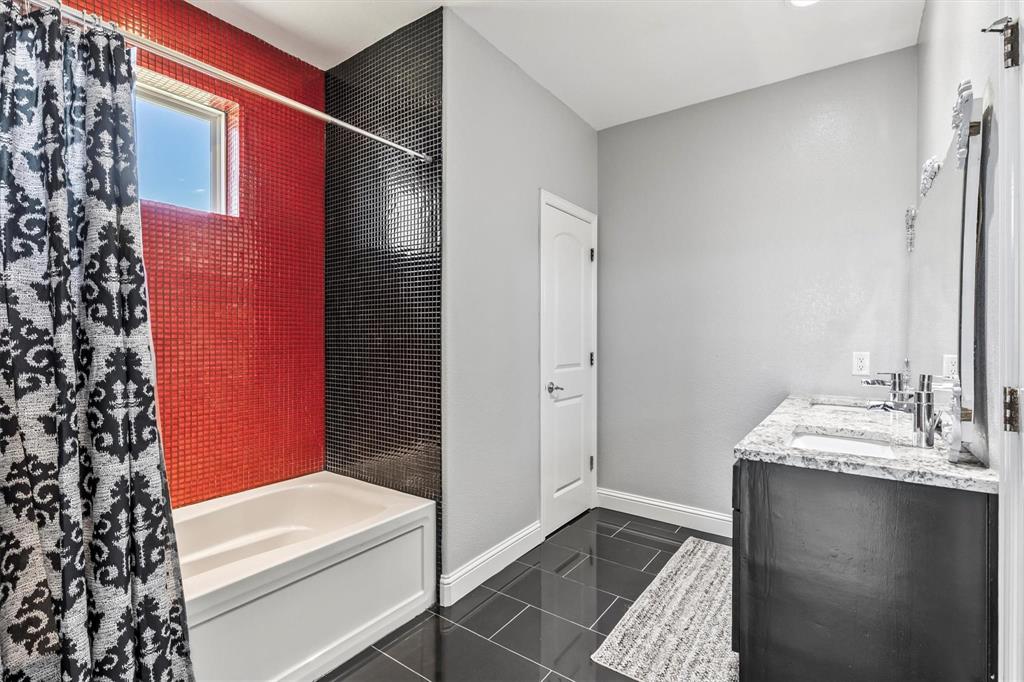 9583 Neal Road Forney, TX 75126 - Photo 20 of 34 a bathroom with a sink and a mirror