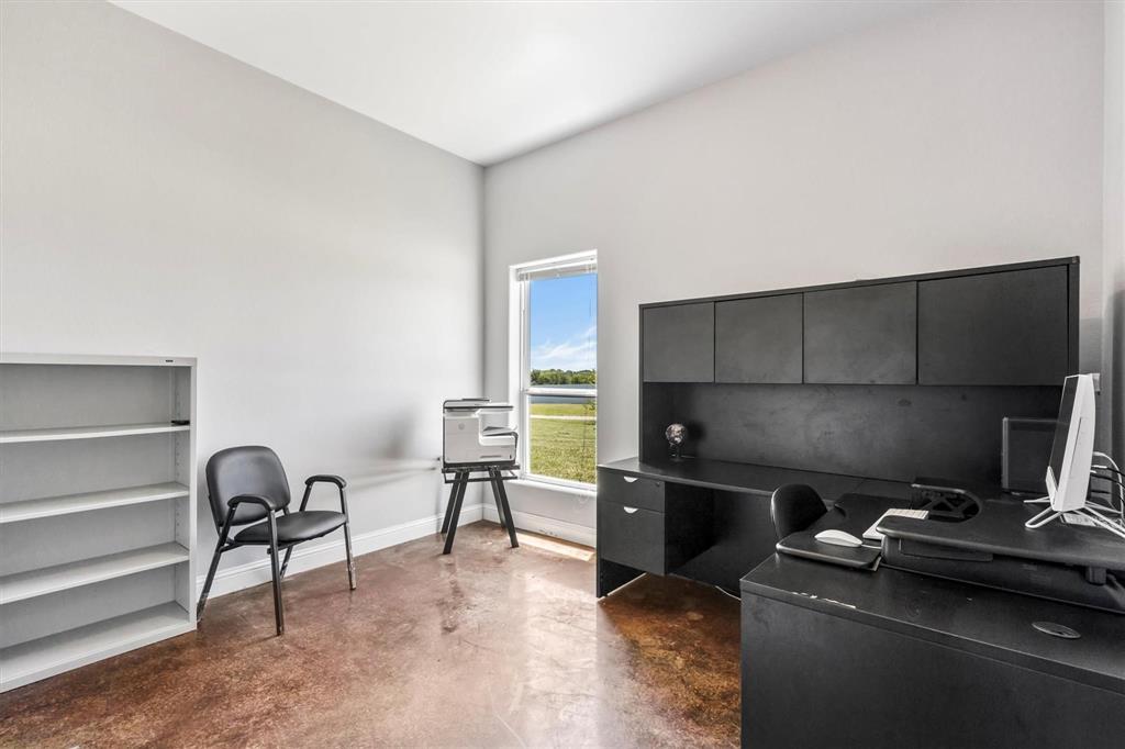 9583 Neal Road Forney, TX 75126 - Photo 3 of 34 a workspace with furniture and a gate