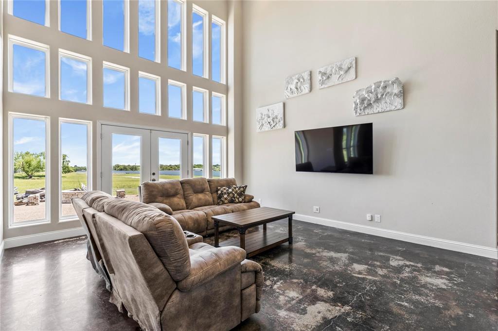 9583 Neal Road Forney, TX 75126 - Photo 5 of 34 a living room with furniture and a flat screen tv