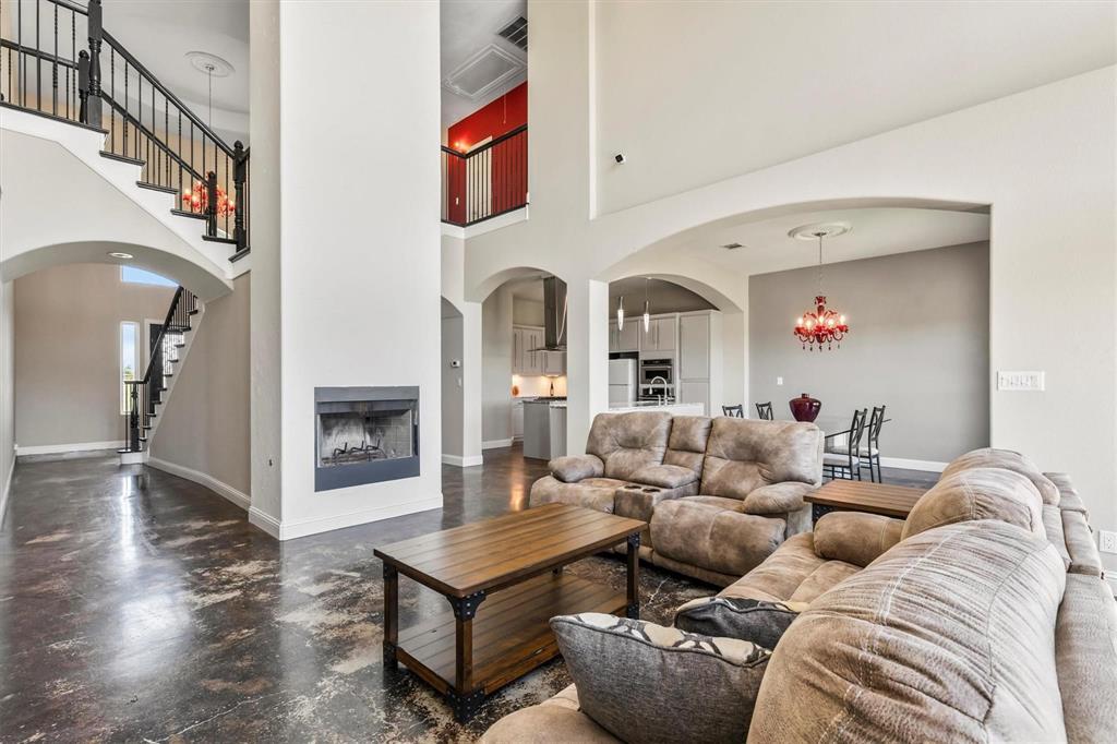 9583 Neal Road Forney, TX 75126 - Photo 6 of 34 a living room with furniture and a fireplace