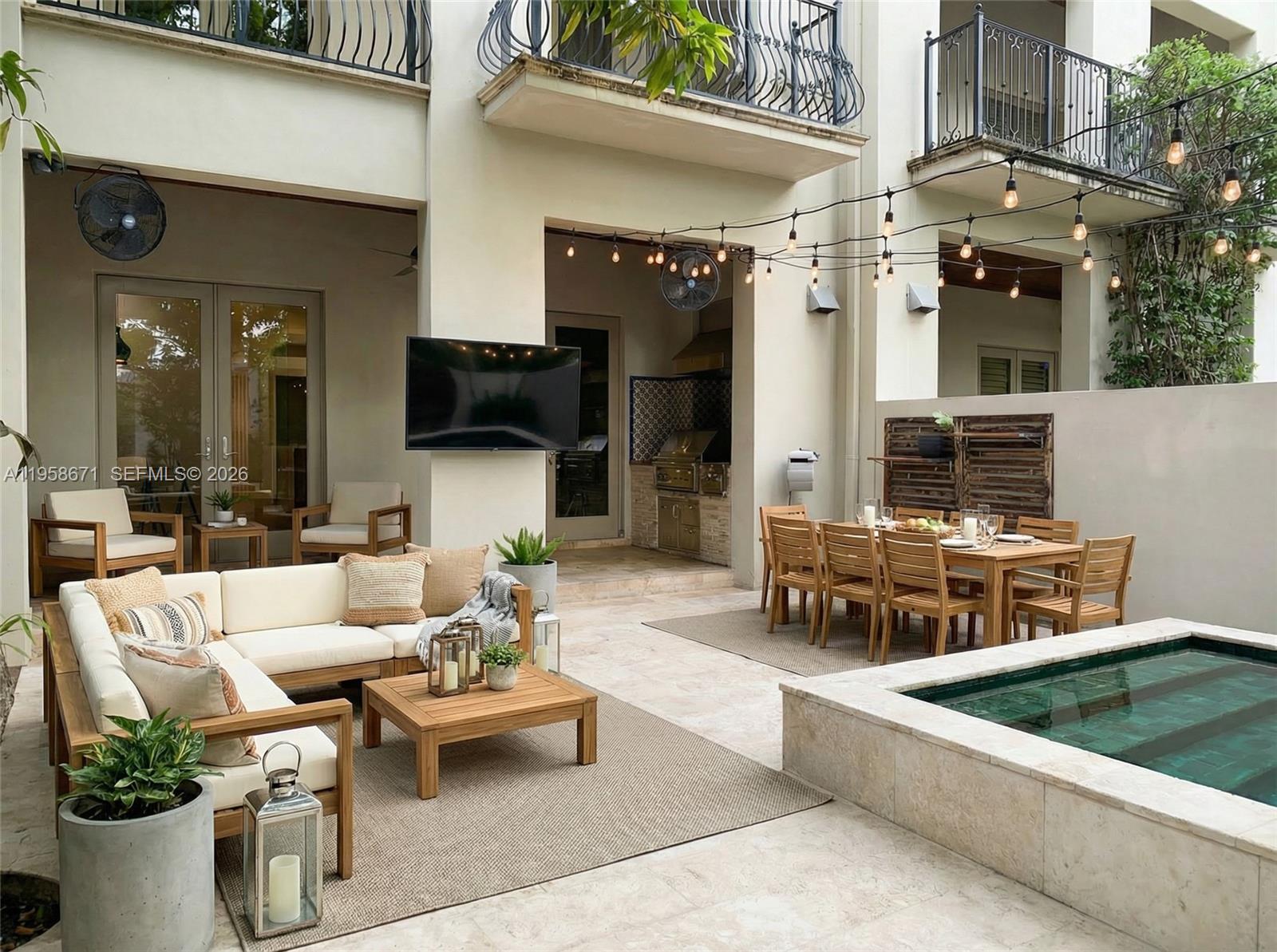 7560 Southwest 56th Court Miami, FL 33143 - Photo 16 of 30 a view of a patio with couches table and chairs