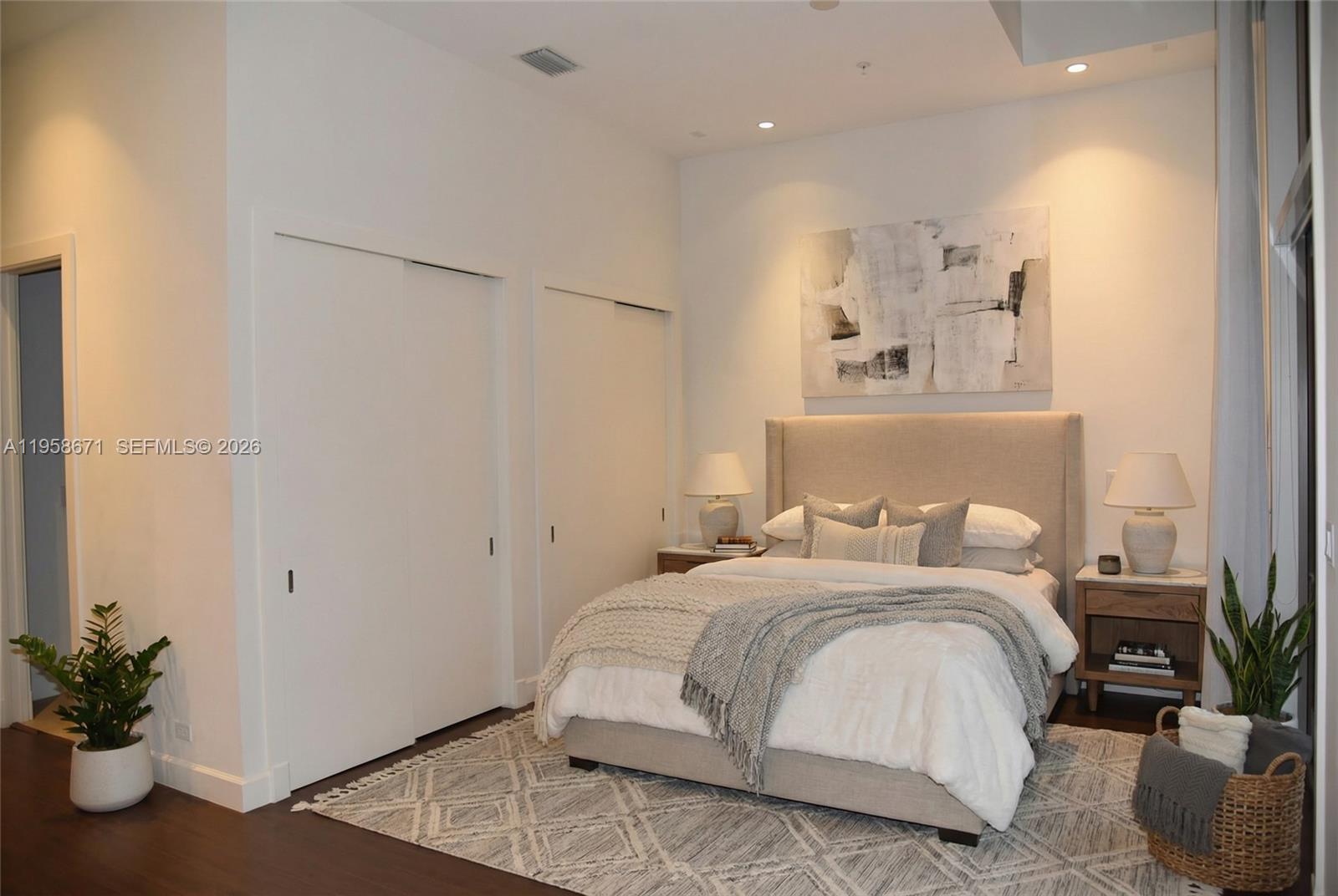 7560 Southwest 56th Court Miami, FL 33143 - Photo 18 of 30 a bedroom with a bed and a potted plant