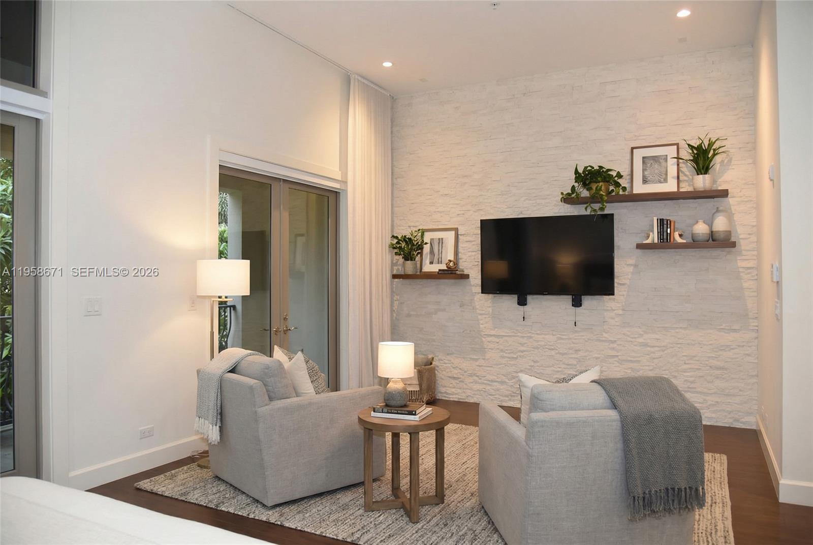 7560 Southwest 56th Court Miami, FL 33143 - Photo 19 of 30 a living room with furniture and a flat screen tv
